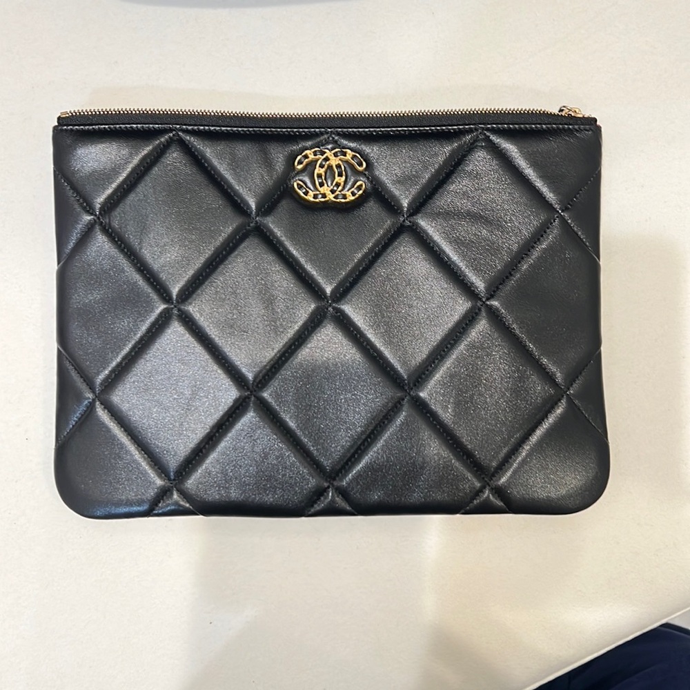 Rare Chanel black quilted soft leather pouch with pink inside.